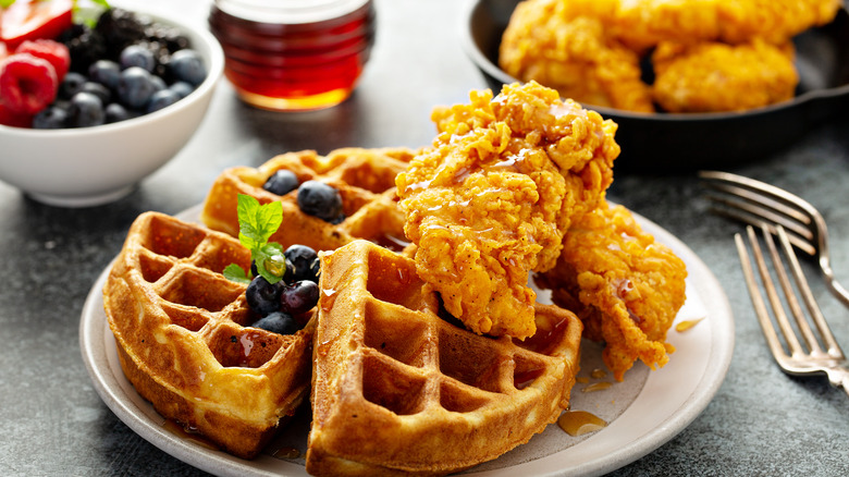 Chicken and waffles with blueberries