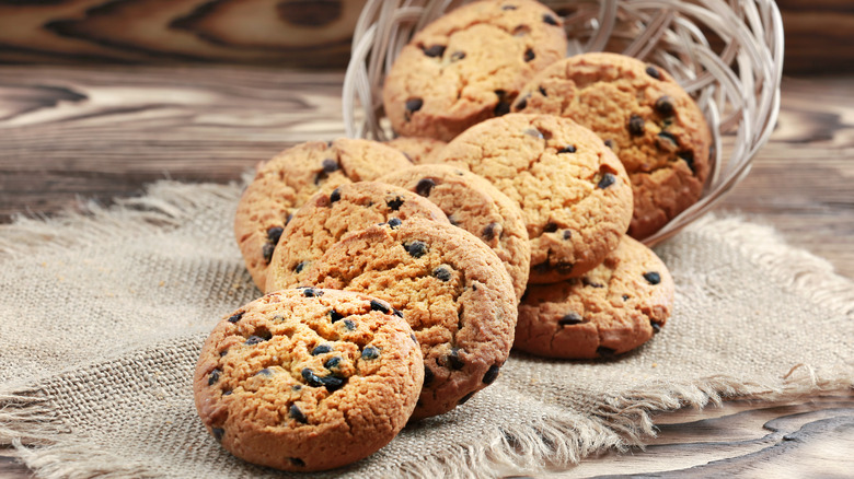 chocolate chip cookies falling out of a basket