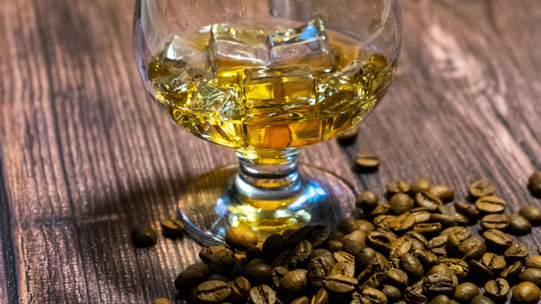 whiskey on ice with coffee beans