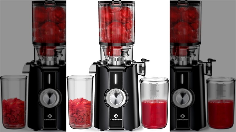 LinkChef Rush Clear Slow Masticating Juicer Machine with red juice and white background