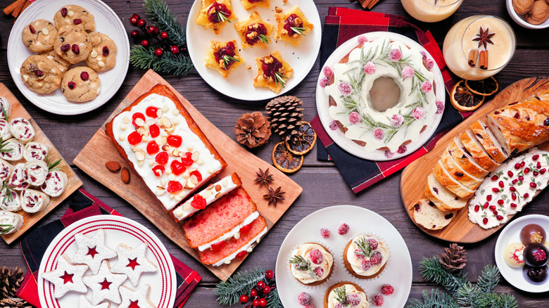 table filled with a variety of holiday desserts