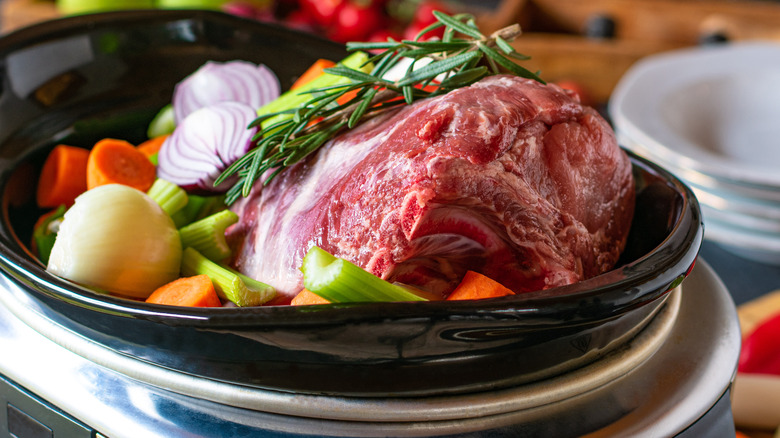 Roast pork and vegetables in slow cooker