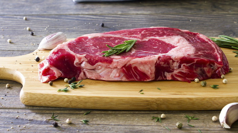 ribeye steak on cutting board