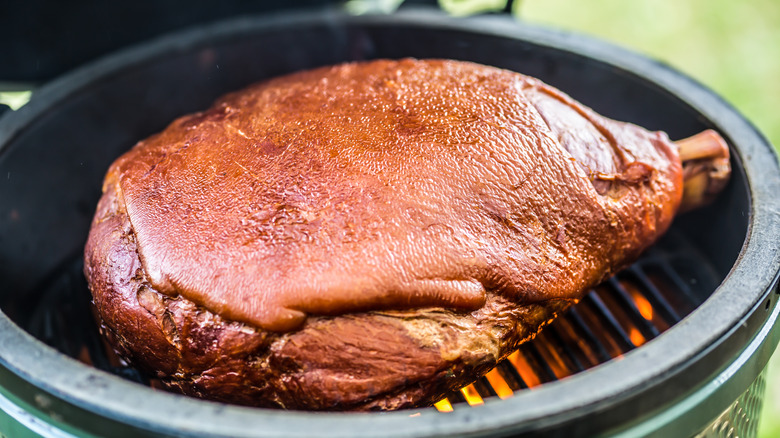 Smoking ham on grill