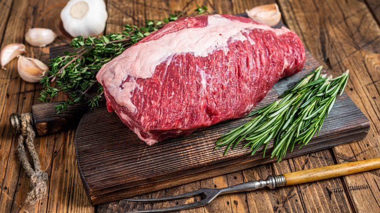 raw beef brisket with rosemary