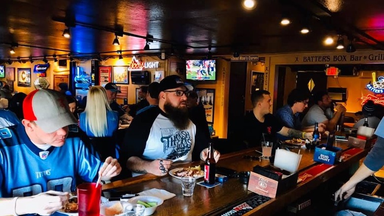 Patrons sitting at The Batters Box bar