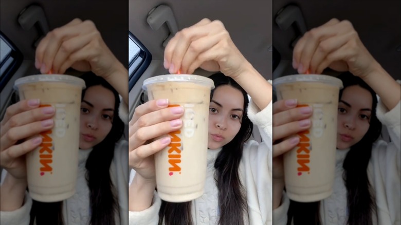 Person stirring French vanilla and blueberry drink