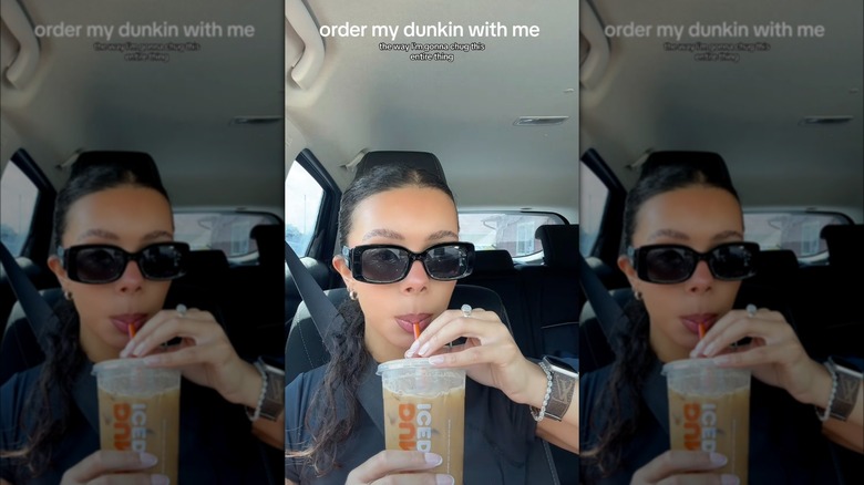 Person with sunglasses sipping coffee in a car