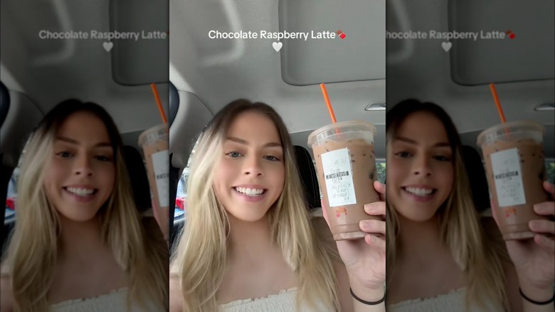 Person holding a chocolate raspberry latte
