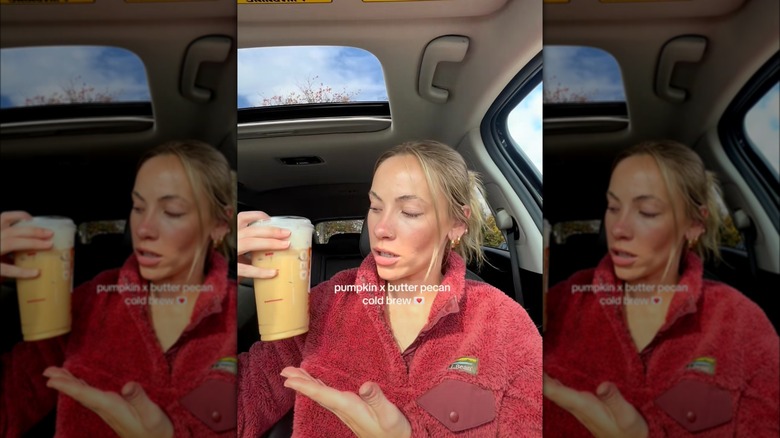 Person holding pumpkin and butter pecan coffee