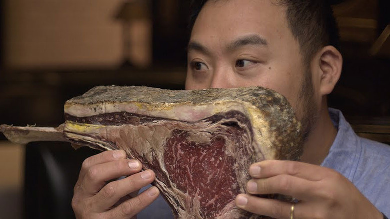 David Chang holding big steak