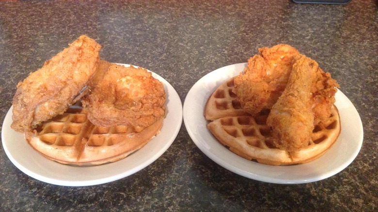 two plates of chicken and waffles