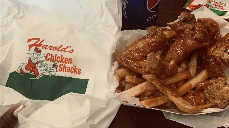 harold's bag with sauced chicken and fries