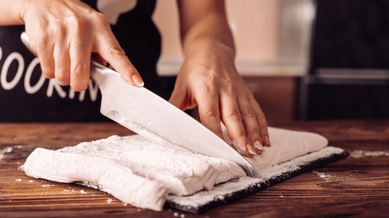 person cutting homemade marshmallows