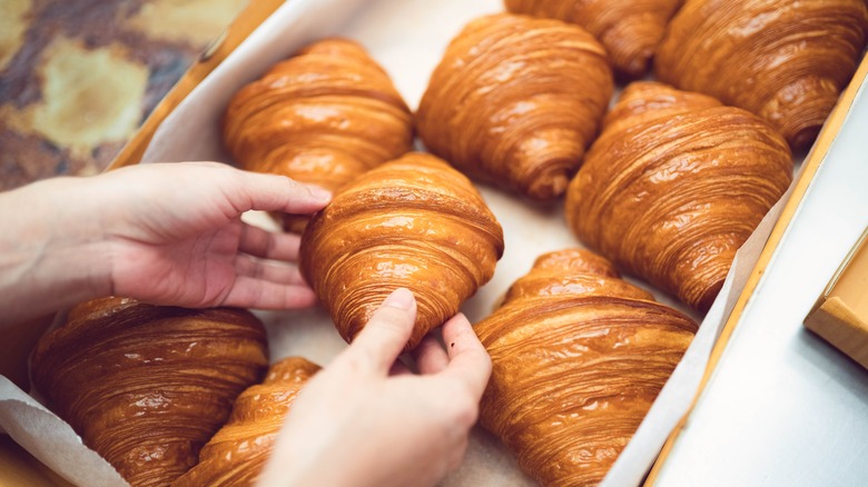 croissants in bakery wooden tray