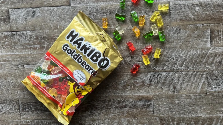 Haribo gummy bears strewn across a table.