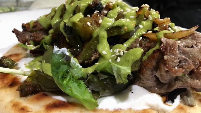 Steak gyro with green sauce