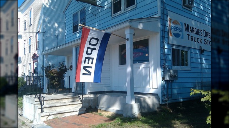 Outside of Margie's Dream Diner with open flag in New Hampshire