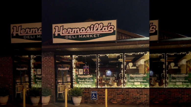 Exterior shot of Hermosilla's Deli Market in West Virginia at night