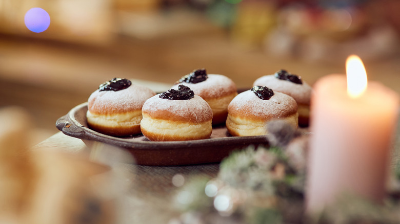 Plate of Sufganiyot and candle