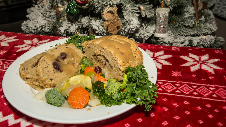 Tofurky and vegetables on plate