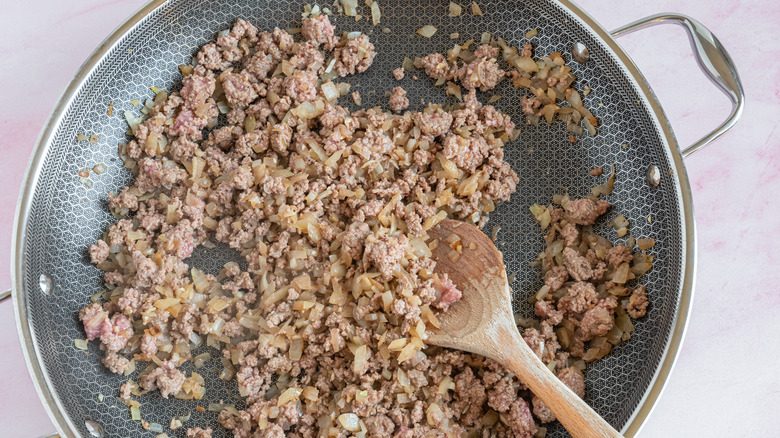 cooking ground beef and onions