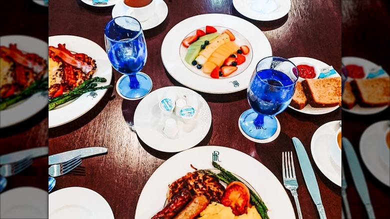 Brunch buffet foods on white plates with blue water glasses at Regency Room Hotel Roanoke