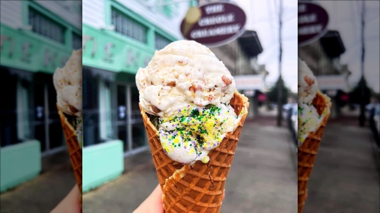 holding ice cream waffle cone