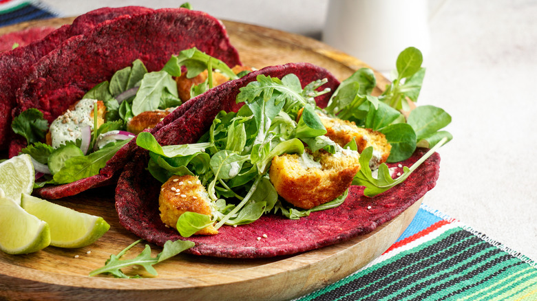 Tacos with beetroot tortillas