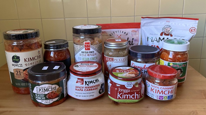 Variety of kimchi jars on table