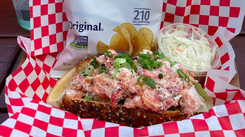lobster roll topped with scallions