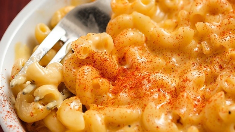 fork in bowl of mac and cheese