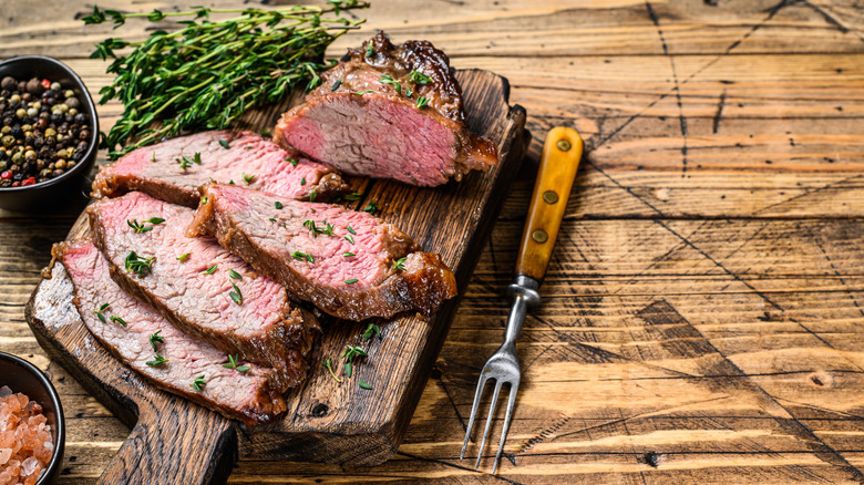 tri-tip roast on board with fork