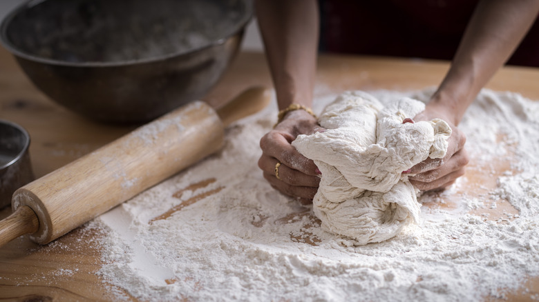 Hands kneading dough