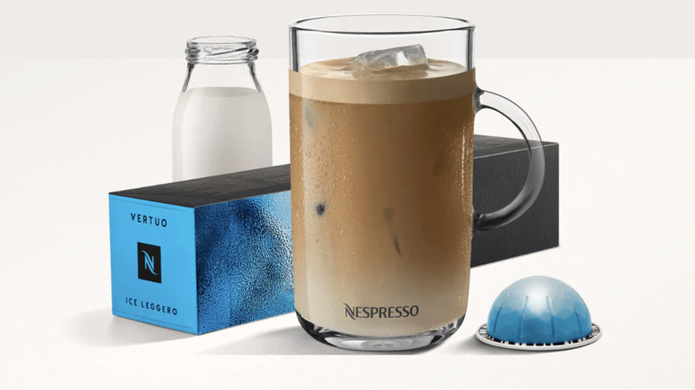 Nespresso Ice Leggero pods next to a coffee mug