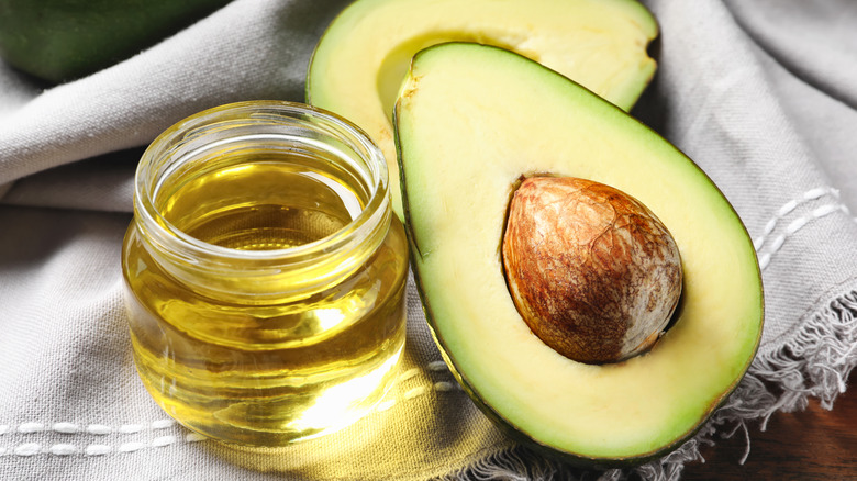 Avocado oil with ripe avocado