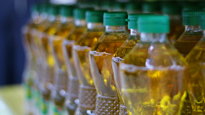 plastic oil bottles in a row