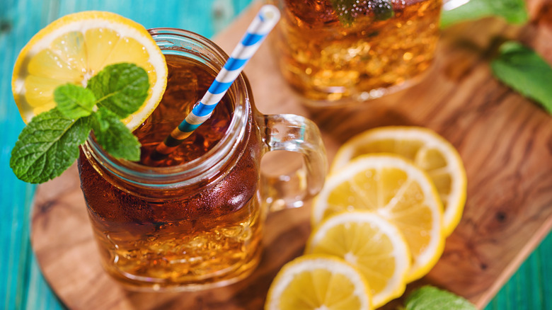 Fresh iced tea garnished with mint and a lemon slice