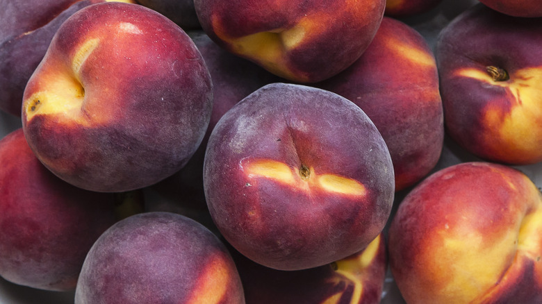 Close up of peaches with red skin