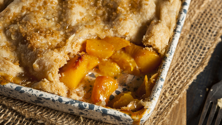 peach cobbler in baking dish