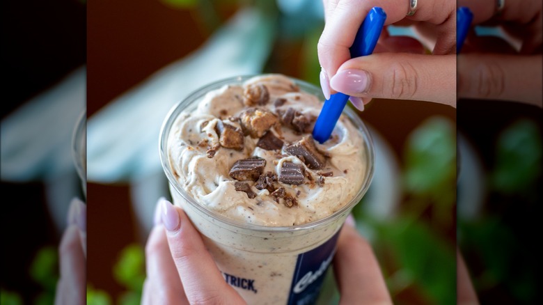 Culver's hands holding a Concrete Mixer