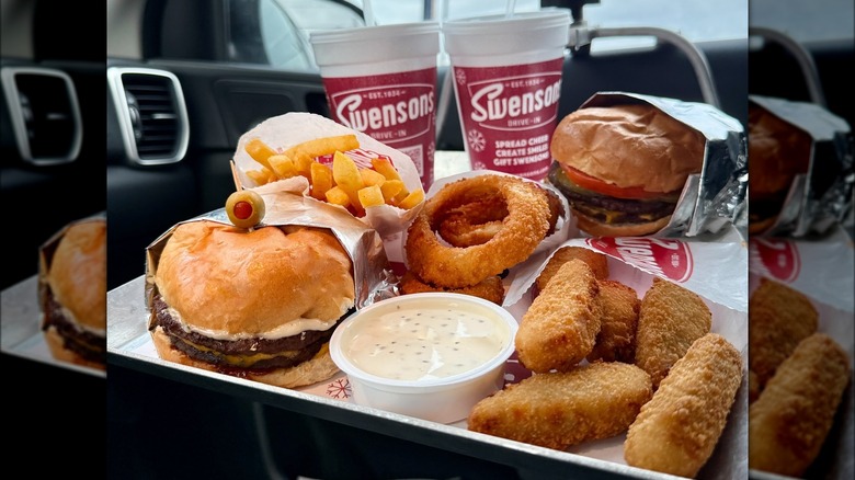 Swensons Drive-In tray of drinks, burgers, fries, onion rings, and potatoes