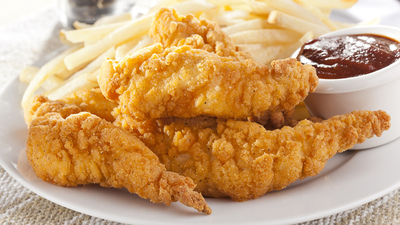 Chicken tenders with fries and sauce