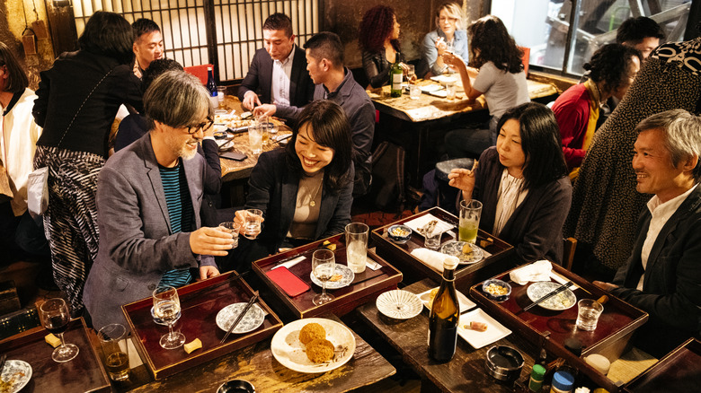 group eating at busy restaurant