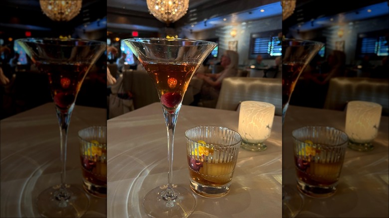 red cocktail on glass-topped table