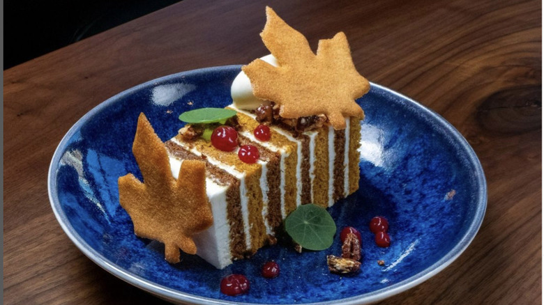 Pumpkin spice cake with frosting and cookies