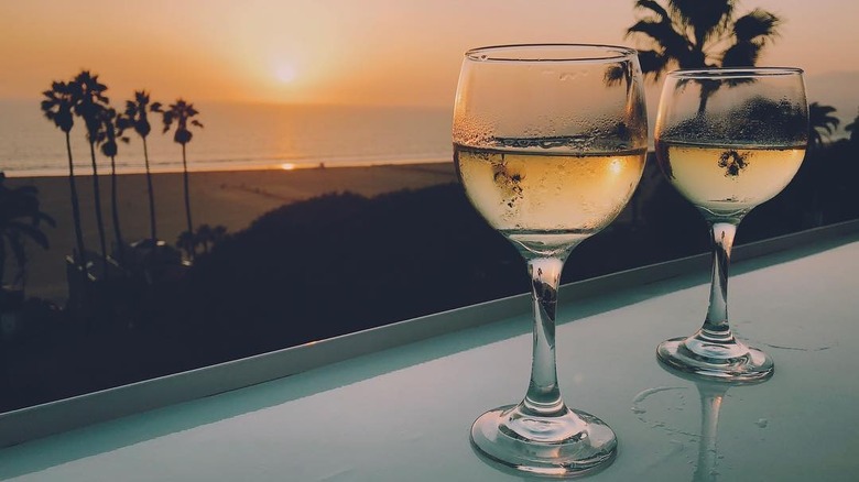 santa monica beach rooftop from Onyx Rooftop Bar with two glasses of wine