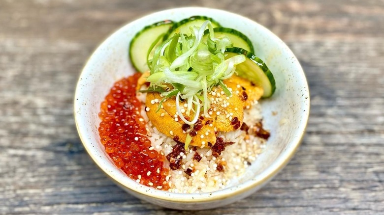 bowl with uni, roe, rice, and veggies