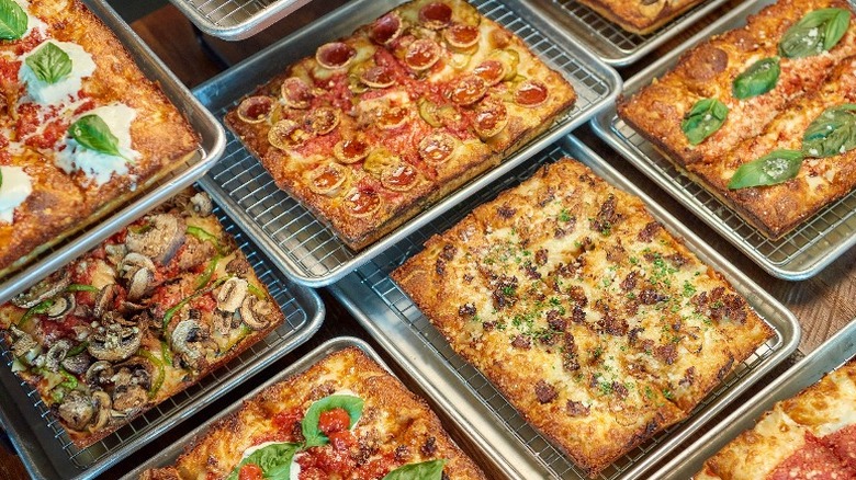 A bunch of different Emmy Squared pizzas 