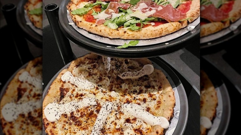 Two gluten-free pizzas stacked